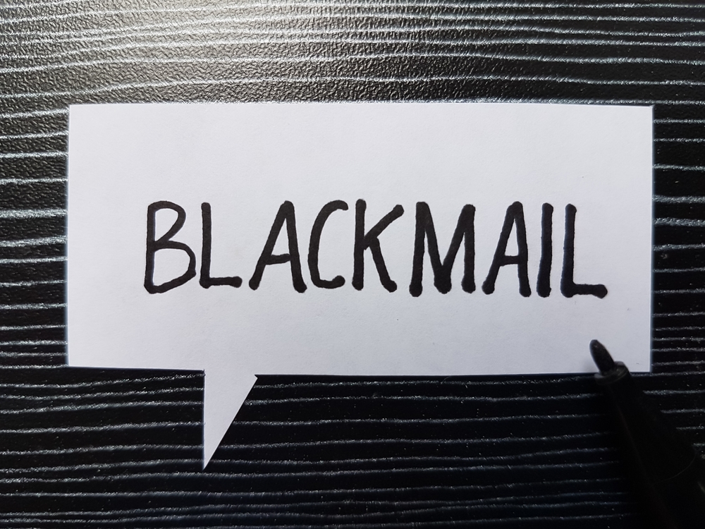 Blackmail,Writting,On,Table,Background.