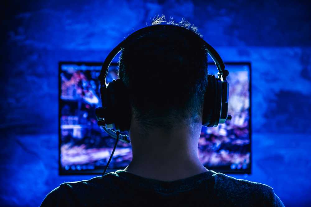 Men,Wearing,Headphones,Playing,Video,Games,Late,At,Night