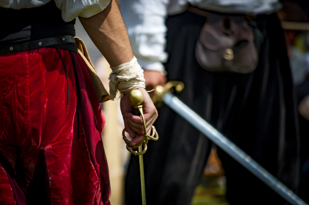 Closeup,On,The,Hand,Holding,A,Sword,Of,A,Pirate