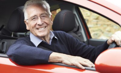 Old man smiling car driving